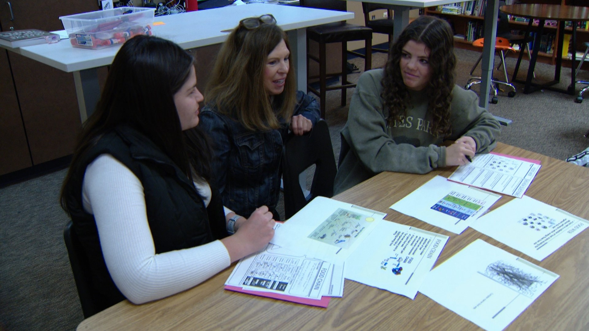 Debbie Rabideau, center, is an English teacher and mentor for the EDGE program at Legend High School